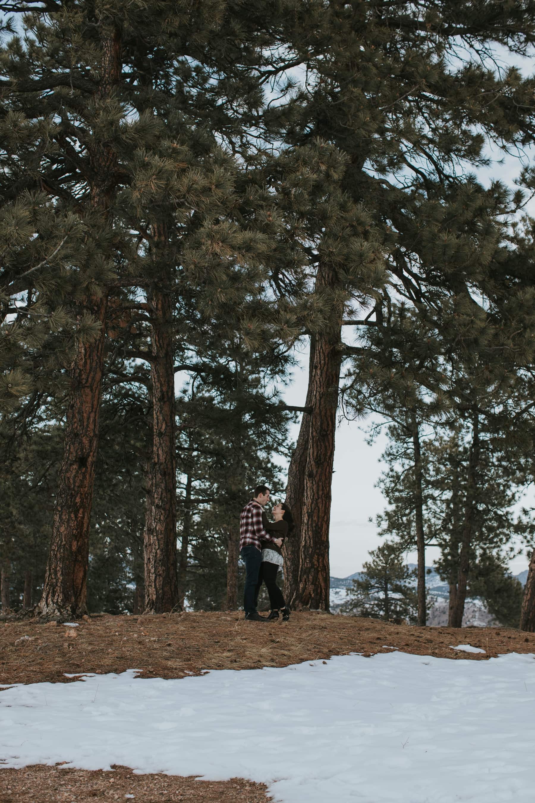  candid engagement photos, diamond engagement ring, engageed engineers, golden engagement photographer, golden engagement photography, golden winter engagement, laughter during engagement session, lookout mountain engagement, round engagement ring, texans in colorado, winter engagement