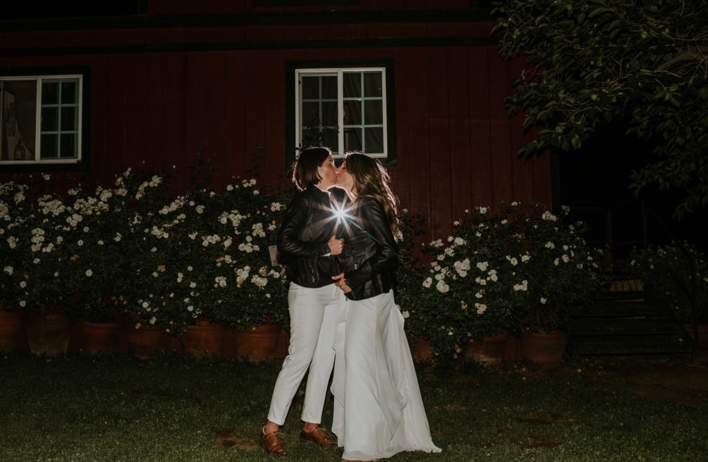 california wedding, gay wedding, brides, night time wedding portraits, matching leather jackets, kissing brides, california gay wedding